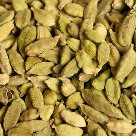 Whole green Certified Organic Cardamom Pods, ideal for adding rich, aromatic flavors to traditional Indian dishes and teas.