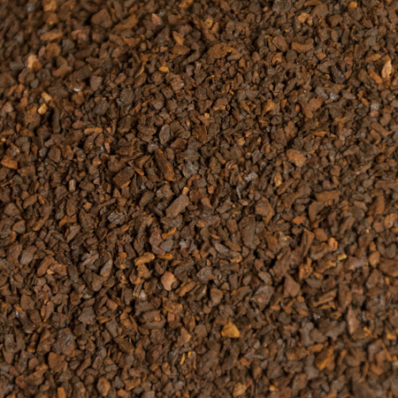 Freshly roasted Organic Chicory Root, a perfect coffee substitute, displayed in a natural, earthy setting.